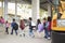 Elementary school kids arrive at school from the school bus