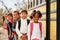 Elementary school kids queueing to get on to a school bus