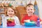 Elementary School Pupils With Healthy And Unhealthy Lunch Boxes