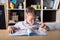 Elementary school. Talented child. Teachers day. School kids. Back to school. Kid is learning in class on background of blackboard