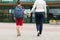 Elementary student boy with mother going to school