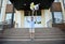 Elementary student, boy rejoices at the end of lessons and school, throws workbooks up, laughing and smiling happily while