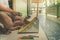 Elementary student sharpen the color pencil into the dustpan