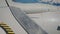 Elements of Aircraft Wing of flying as seen by passenger through porthole windows.