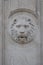 Elements of architectural decorations of old wall, stone lion head sculpture figure