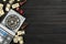 Elements of different board games on dark wooden table, flat lay. Space for text