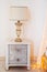 Elements of interior. vintage bedside table with table lamp