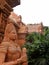 Elements of stucco and statues of the abandoned hotel in angkor style. Style of the temple ruins of the Khmer