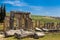 The elements of the wall of a ruined ancient house. Beautiful background of the ruins of Greek cities.