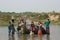 Elephant drover washes a Nepalese elephant in the river of Chitwan National Park in southern Nepal. Elephant sprinkles water from