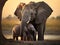 Elephant protecting tiny elephant between legs, trunk cuddling with sibling. Elephants, babies, Botswana, Africa.