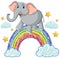 An elephant standing atop a vibrant rainbow