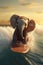 Elephant surfer on a surfboard, having fun on the sea waves,