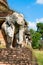 Elephants statues on ruins of Buddhist temple.