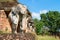Elephants statues on ruins of Buddhist temple.