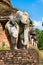 Elephants statues on ruins of Buddhist temple.