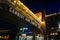 Elevated bridge and shops in Cannery Row at night, in Monterey