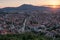 Elevated cityscape view of the city of Prizren, Kosovo, during sunset on a summer day.