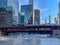 Elevated `el` train crosses a steamy Chicago River as temperatures plunge