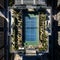 Elevated Match Point - Aerial View of Rooftop Tennis Court Atop a Skyscraper