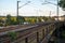 Elevated railroad tracks in an urban setting at sunset