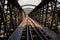 Elevated railway bridge with an old-fashioned design, spanning a wide river