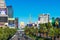 Elevated scenic view of The Strip during day time. Light traffic on Las Vegas Boulevard. Modern hotels, resorts and casinos