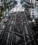 Elevated Train Tracks above the streets between buildings at The Loop - Bleached Portrait Artistic Effect