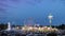 Elevated view of carnival midway rides against twilight sky