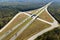 Elevated view of freeway exit junction over road lanes with fast moving traffic cars and trucks. Interstate