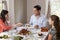 Elevated view of Jewish family serving food at Shabbat meal