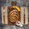 elevated view snail sausage wooden cutting board. High quality photo