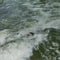 Elevated view of a surfer crashing face first into the waves in Munich Germany.