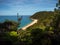 Elevated view of tropical pacific ocean beach surrounded by lush green nature in Abel Tasman National Park New Zealand