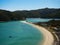 Elevated view of tropical pacific ocean beach surrounded by lush green nature in Abel Tasman National Park New Zealand