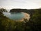 Elevated view of tropical pacific ocean beach surrounded by lush green nature in Abel Tasman National Park New Zealand