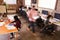 Elevated View Of Workers In Busy Modern Design Office