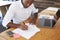 Elevated view of young black man working at office desk