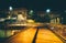 Elevated walkway and buildings at night in Baltimore, Maryland.