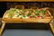 Elevated Wooden Tray with Variety of Gourmet Sandwiches