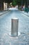 Elevating bollard with illuminated sign closing a road