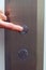 Elevator button pressed with finger