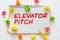 elevator pitch text message on white paper and office supplies, pen, paper note, on white desk