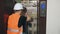 Elevator repair. A professional repairman worker sets up equipment in an elevator shaft and repairs the elevator