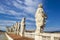 Eleven statues of the saints apostles standing on the roof of Saint Peter`s Basilica in Vatican City, Rome, Italy, back view