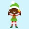 The elf holding a bell in his hand stands straight and stands straight and . The child is happy and smiling and she is delighted.