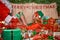 Elf puttings presents in Santa\'s sack