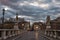 Eliev Bridge and the streets of Rome in the predawn time. Long exposure and blurry clouds in the dawn sky.