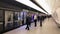 The Elizabeth underground train platform. Passengers waiting for doors to open.