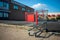 ELKINS PARK, PENNSYLVANIA-MAY 25,2020: A Lone Shopping Cart Rests at the Edge of an Empty Parking Lot. Businesses are struggling